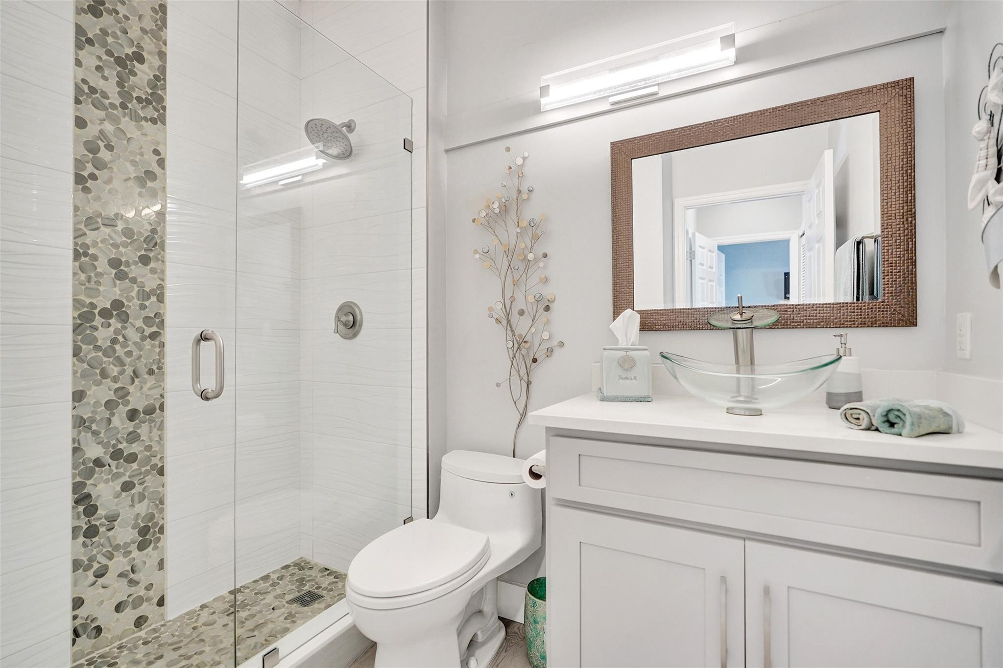 551 Anchor Point Delray Beach, FL 33444 - Photo 26 of 46 a bathroom with a sink a toilet and shower