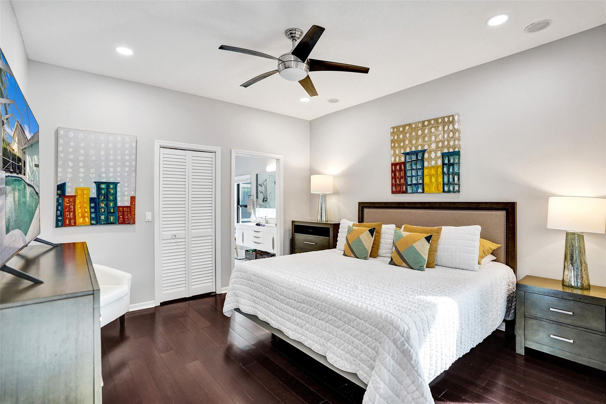551 Anchor Point Delray Beach, FL 33444 - Photo 31 of 46 a bedroom with a bed and wooden floor