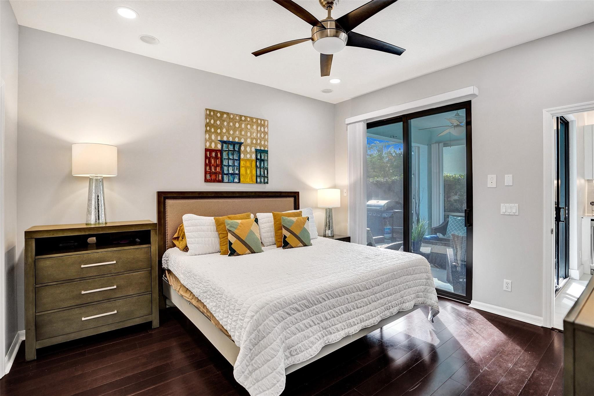 551 Anchor Point Delray Beach, FL 33444 - Photo 32 of 46 a bedroom with a bed and a lamp on table
