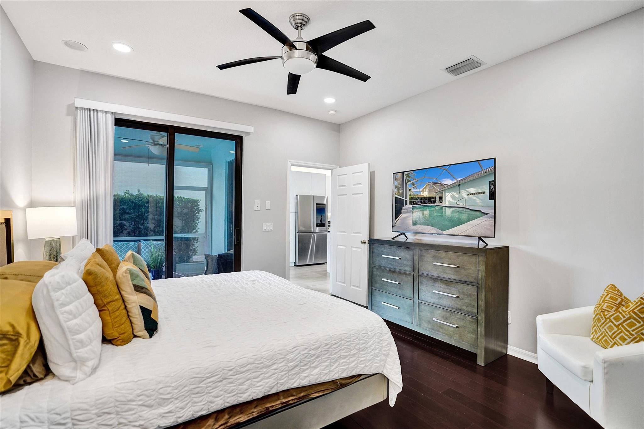 551 Anchor Point Delray Beach, FL 33444 - Photo 33 of 46 a bedroom with a bed and a dresser