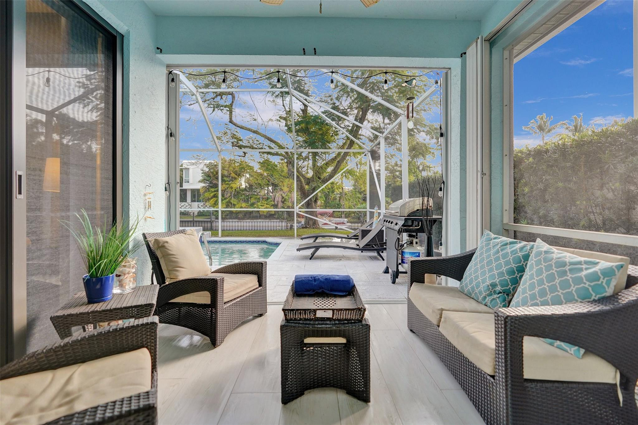 551 Anchor Point Delray Beach, FL 33444 - Photo 38 of 46 a living room with furniture and a floor to ceiling window