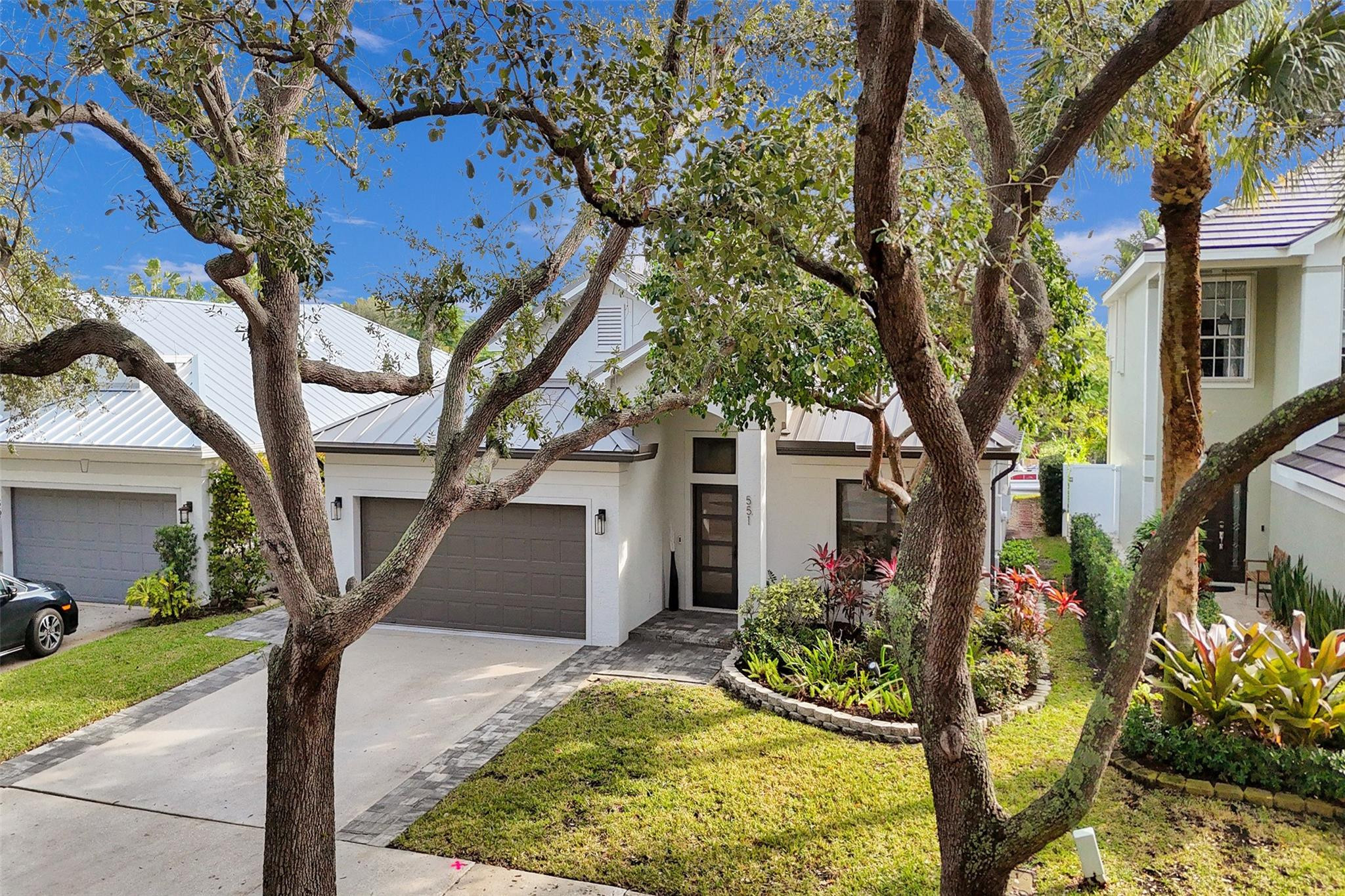 551 Anchor Point Delray Beach, FL 33444 - Photo 8 of 46 a front view of a house with garden