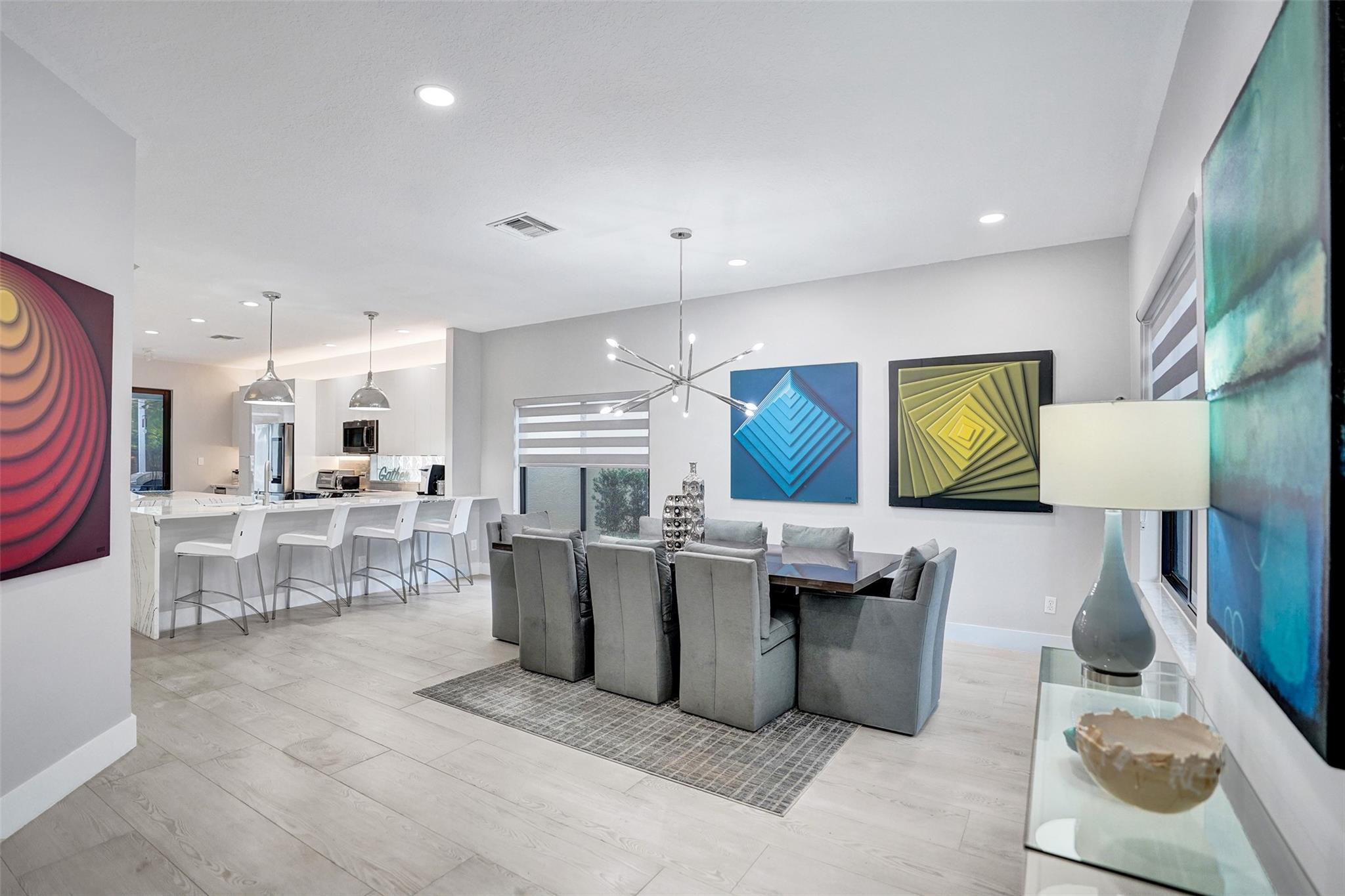 551 Anchor Point Delray Beach, FL 33444 - Photo 10 of 46 a living room with stainless steel appliances kitchen island granite countertop furniture and a view of kitchen