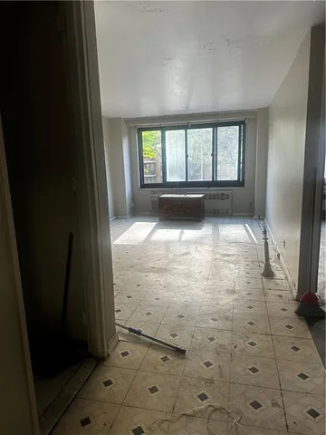 a view of empty room with windows