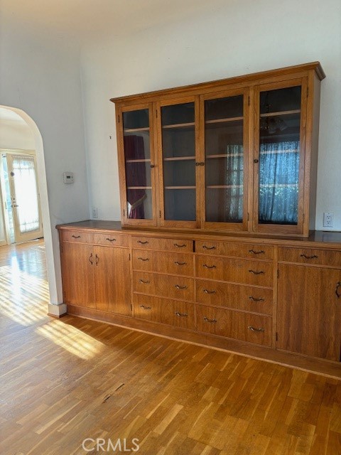 6314 Friends Avenue Whittier, CA 90601 - Photo 4 of 12 wooden floor and white cabinets