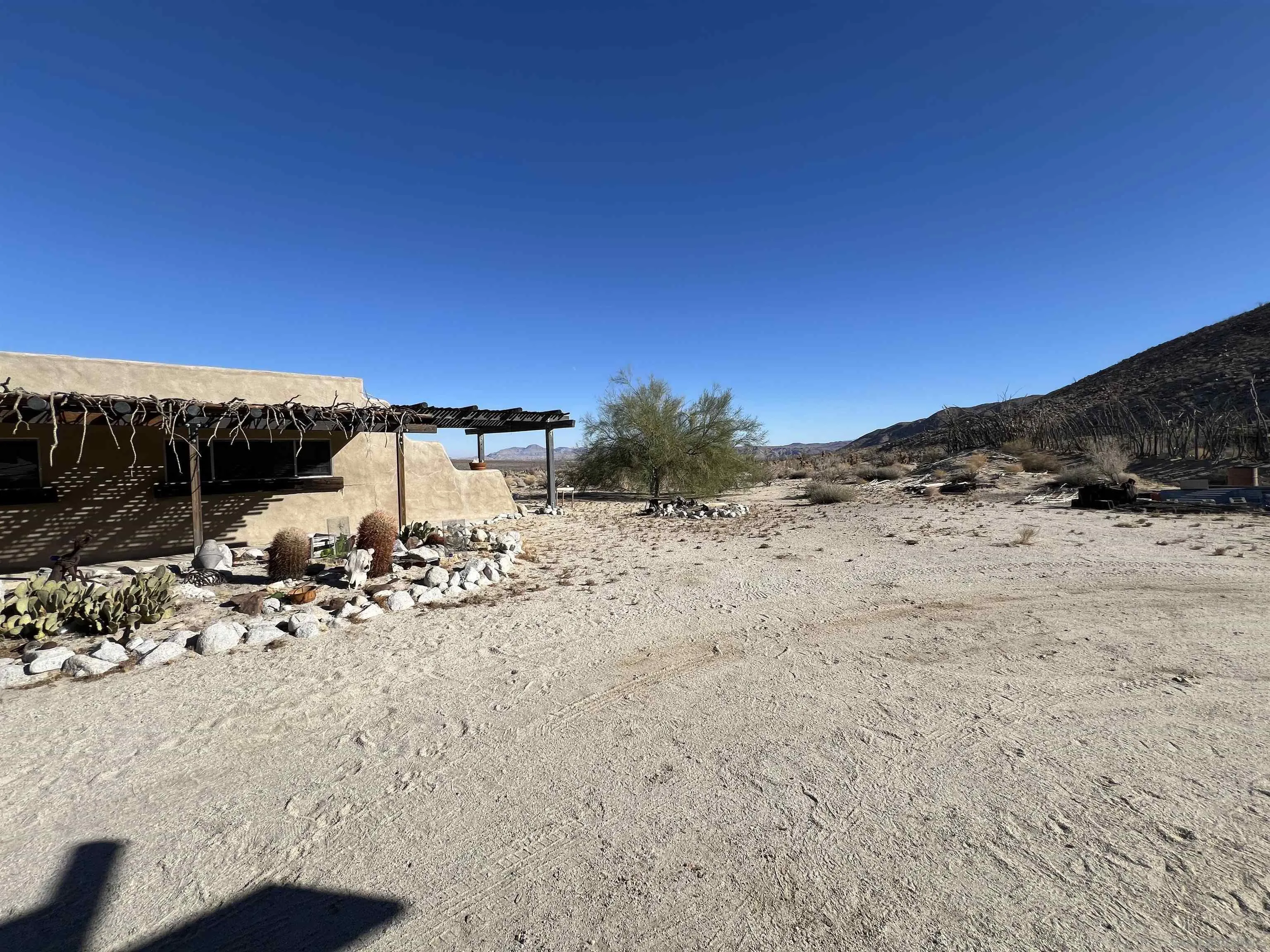 255 Canyon Road Julian, CA 92036 - Photo 18 of 34 a view of white house with a yard covered with snow