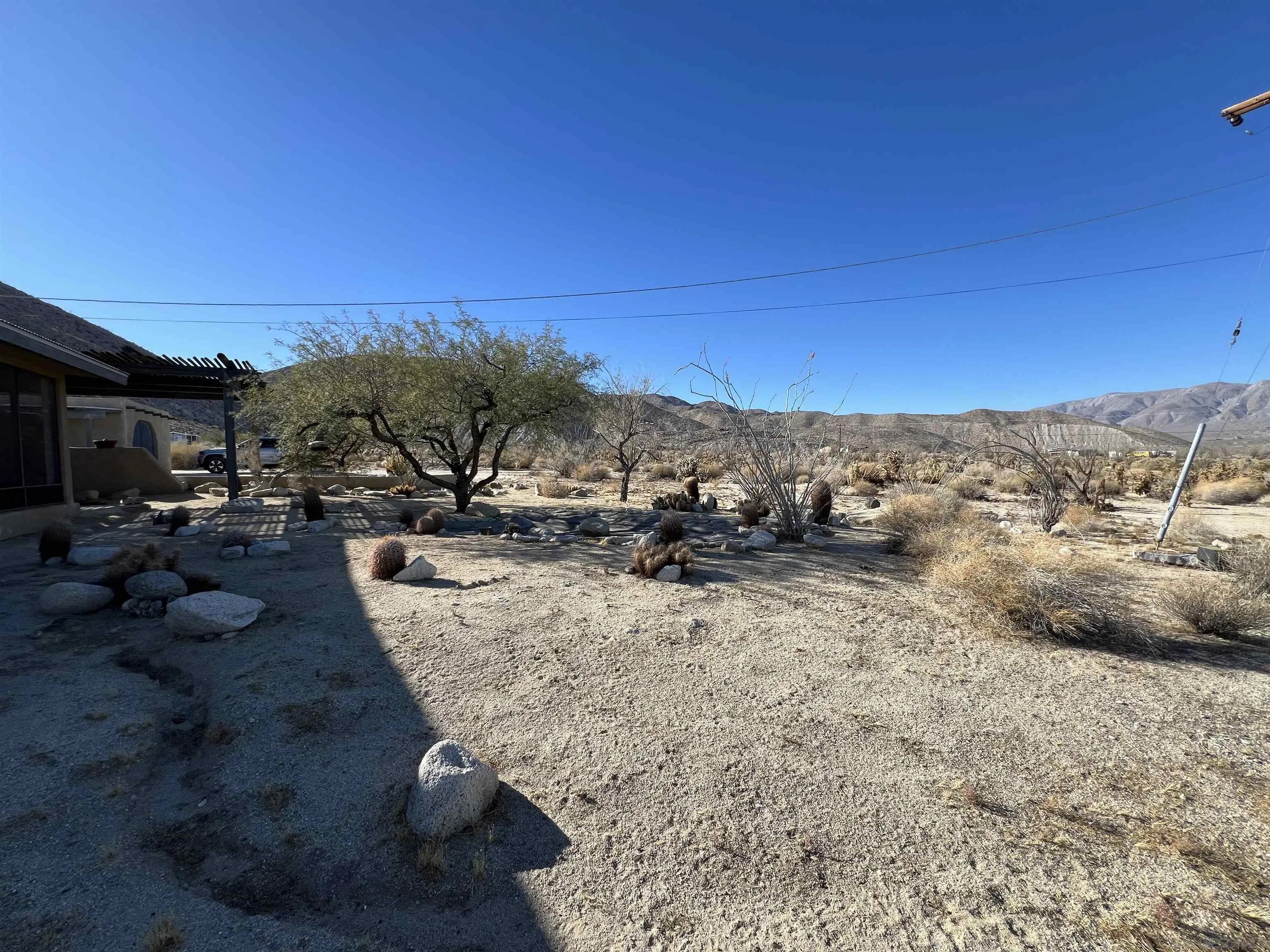 255 Canyon Road Julian, CA 92036 - Photo 8 of 34 a view of a backyard with table and chairs