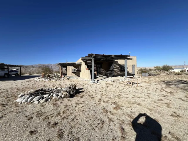 a view of a backyard of the house