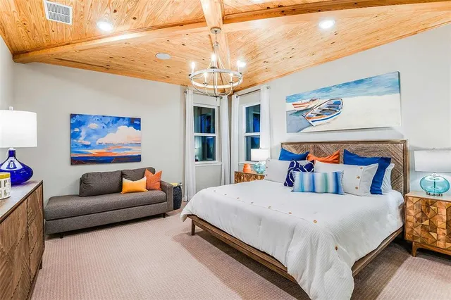 a bedroom with bed and furniture