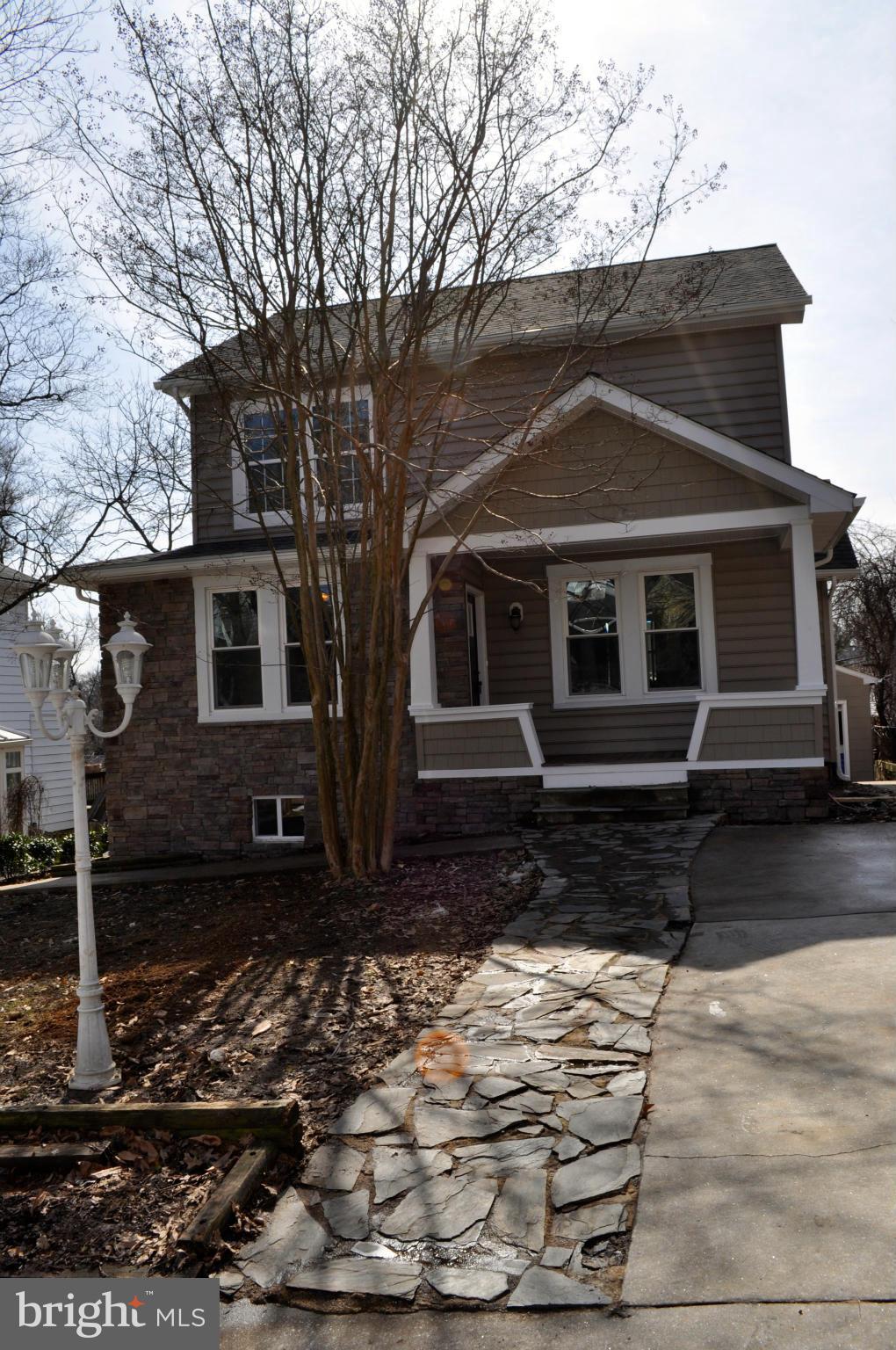 1011 Overbrook Road Baltimore, MD 21239 - Photo 1 of 24 a front view of a house with a yard