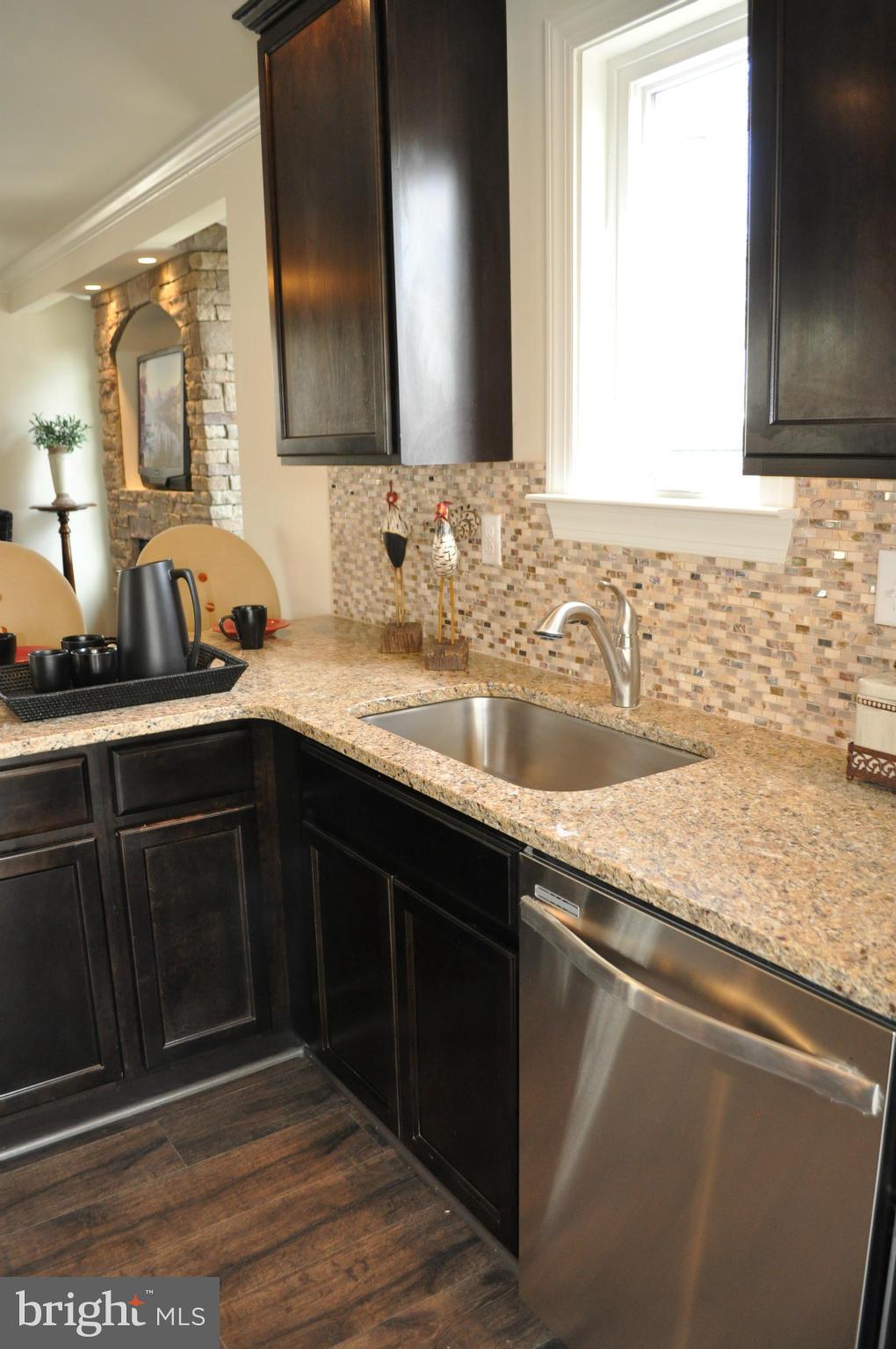 1011 Overbrook Road Baltimore, MD 21239 - Photo 11 of 24 a bathroom with a sink and a mirror