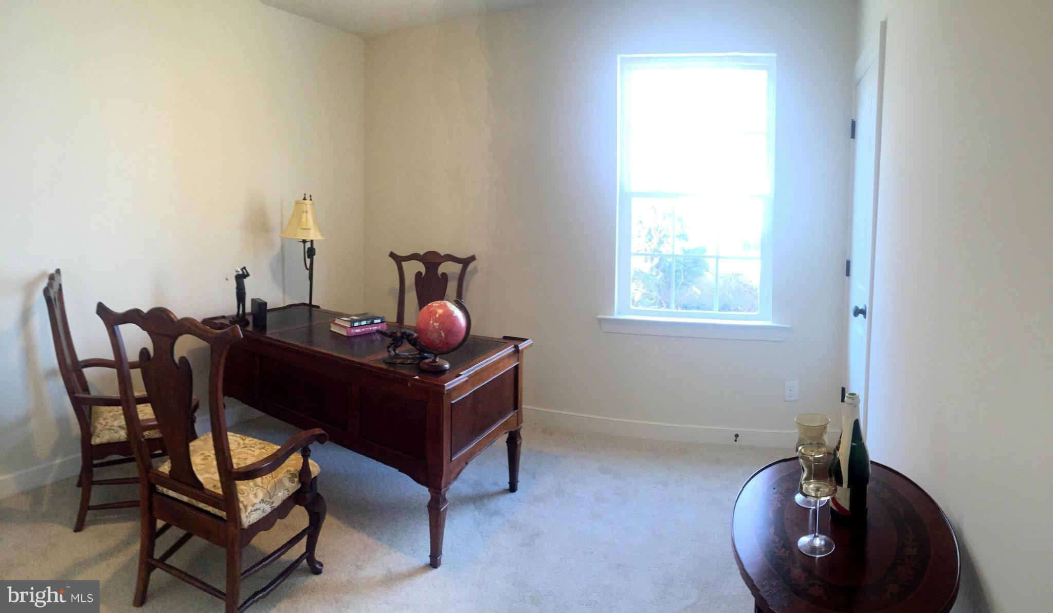 1011 Overbrook Road Baltimore, MD 21239 - Photo 13 of 24 a room with a table chairs and a window