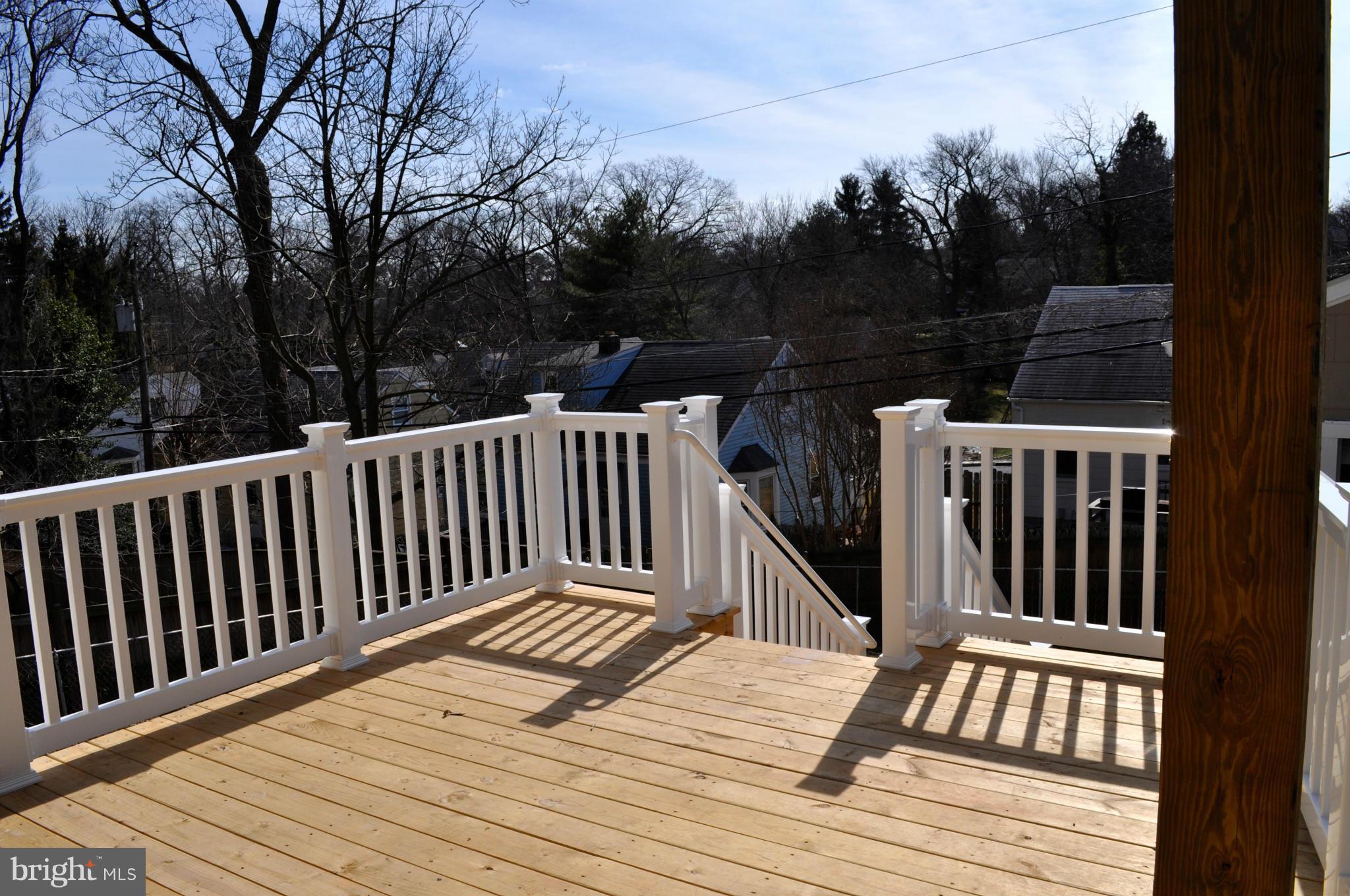 1011 Overbrook Road Baltimore, MD 21239 - Photo 4 of 24 a view of deck with wooden floor and outdoor seating
