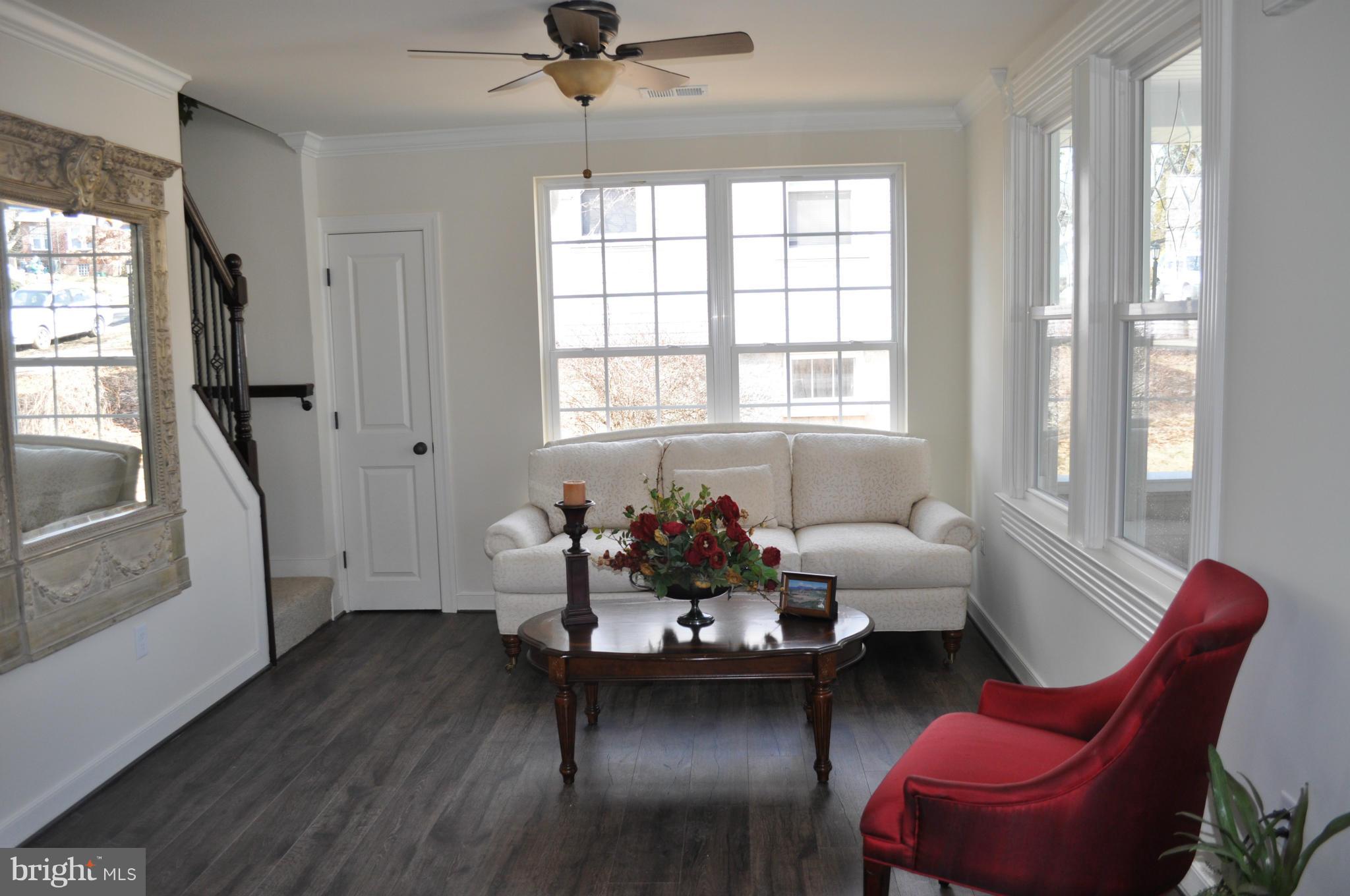 1011 Overbrook Road Baltimore, MD 21239 - Photo 7 of 24 a living room with furniture and windows