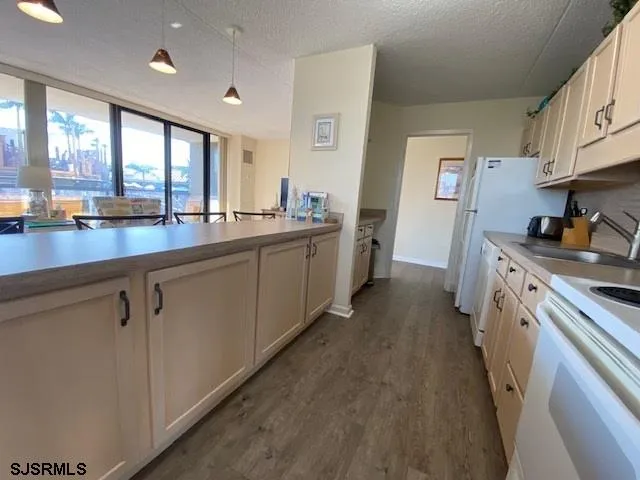 a kitchen with counter top space and sink