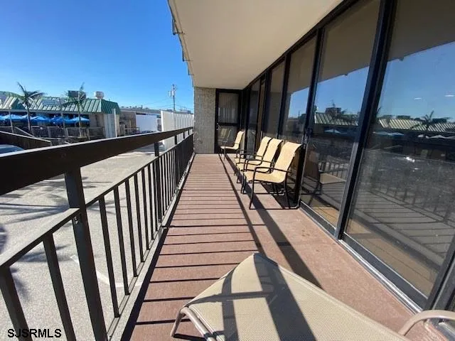 a view of balcony with furniture