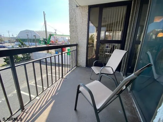 a view of a balcony with furniture
