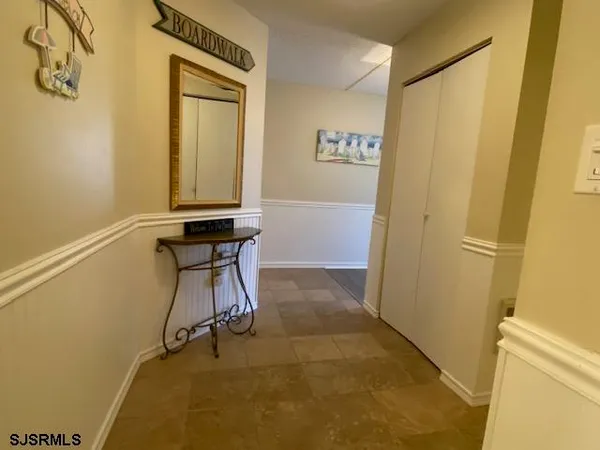 a view of a bathroom with a sink and a mirror