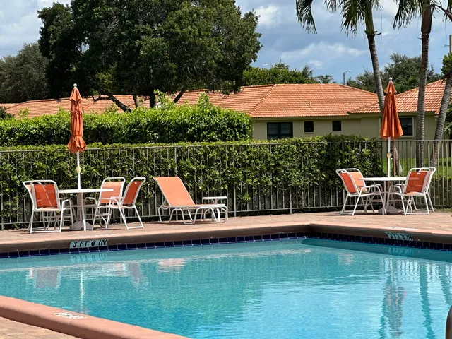 a view of a house with wooden fence