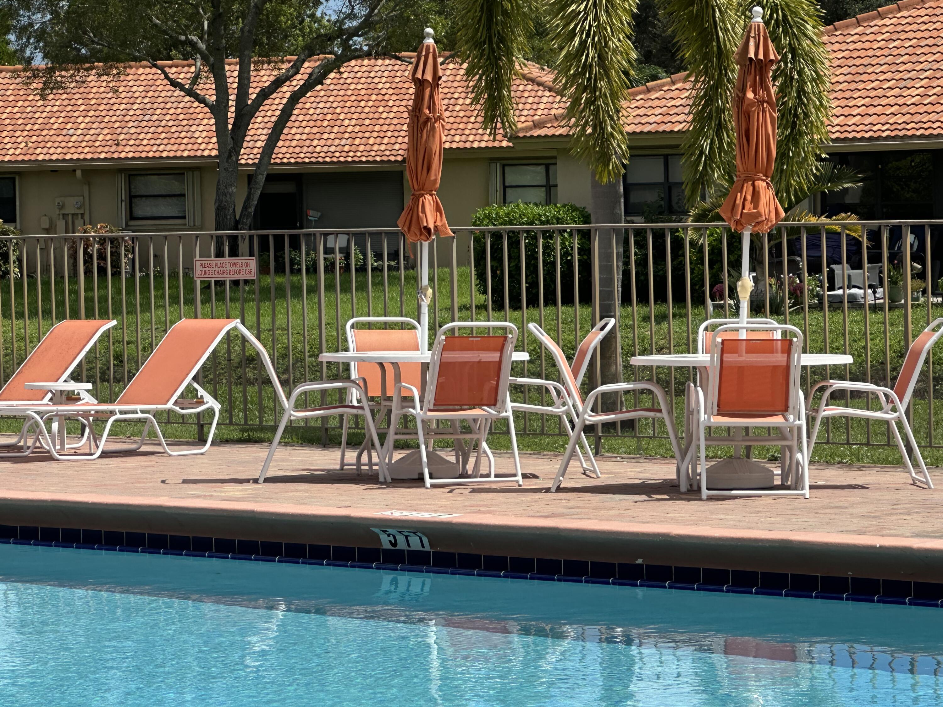 9845 Pineapple Tree Drive, Unit 208 Boynton Beach, FL 33436 - Photo 17 of 21 a childrens park with lots of swings and slides