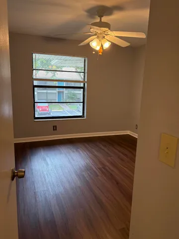 a white toilet sitting next to a shower curtain