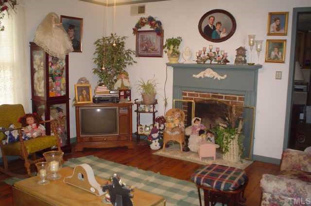 1737 Old Coleridge Road Siler City, NC 27344 - Photo 6 of 8 Living room with wood burning fireplace