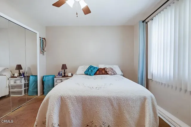 a bathroom with a sink a toilet and shower curtain