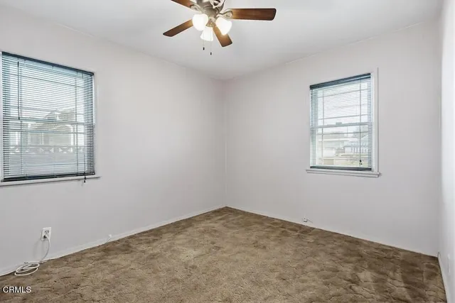 a view of a room that has a window in it