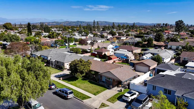a picture of a room with a white wall and a large window