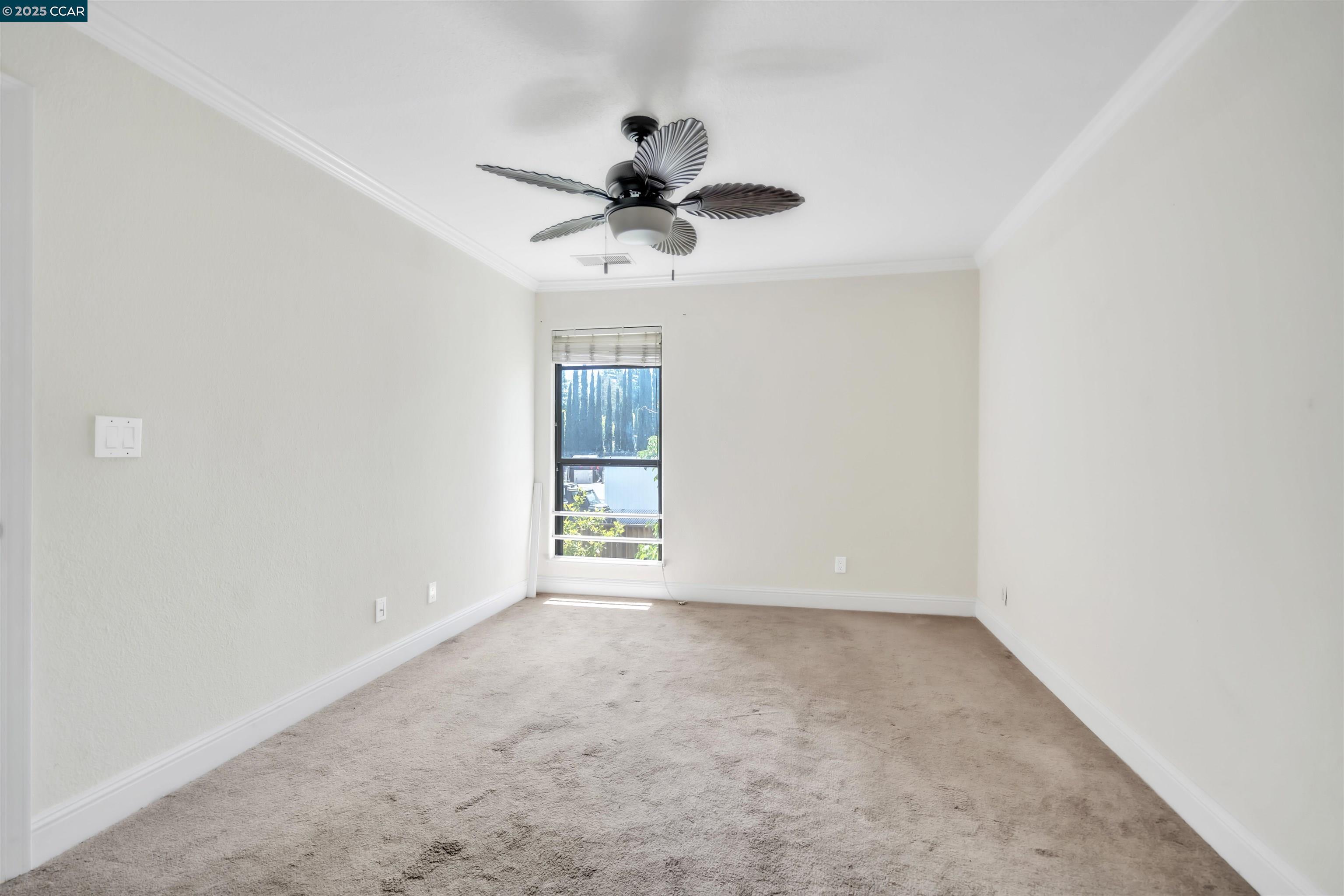 1544 Bailey Road, Unit 30 Concord, CA 94521 - Photo 17 of 20 an empty room with windows and fan