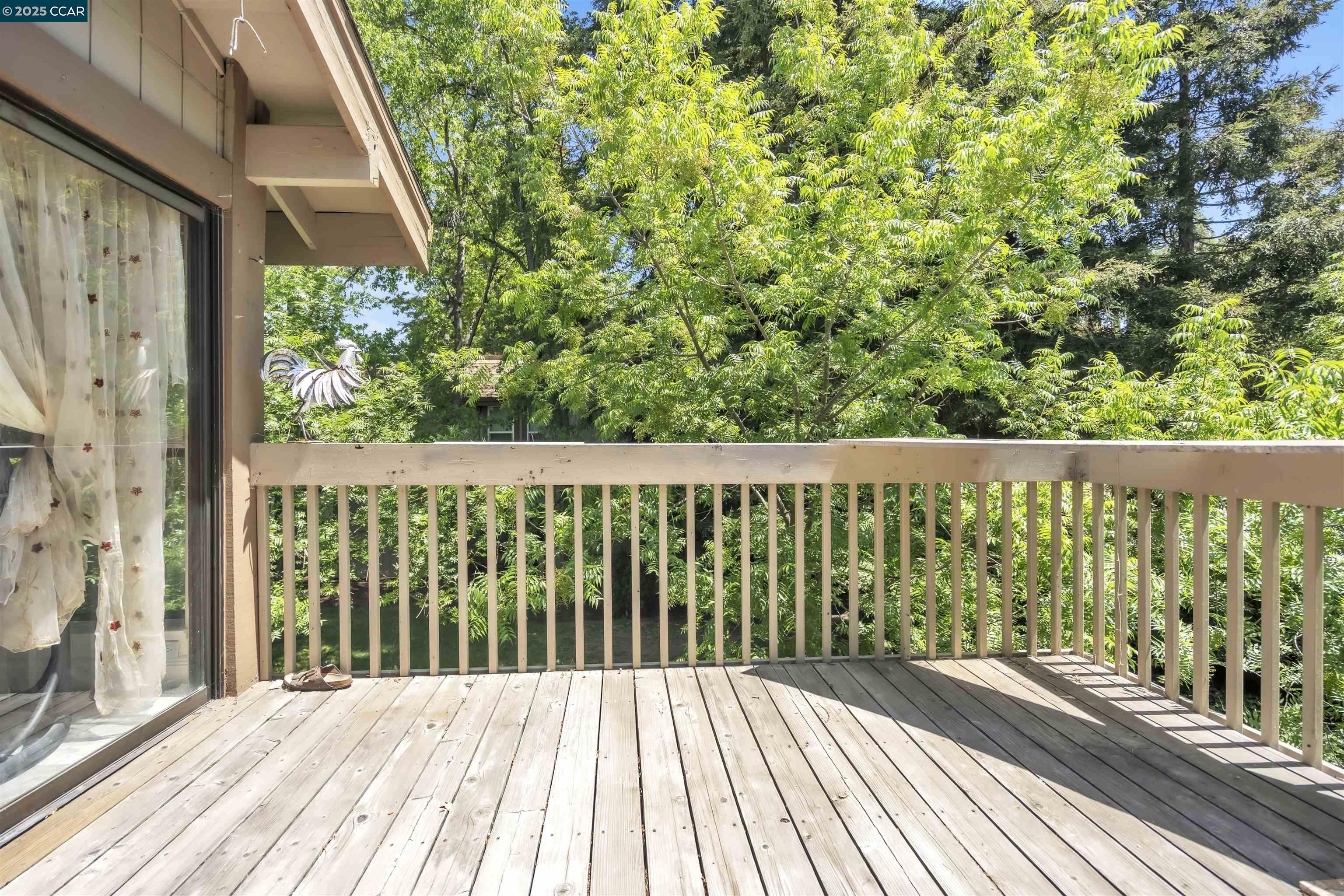 1544 Bailey Road, Unit 30 Concord, CA 94521 - Photo 19 of 20 a view of a wooden balcony with a yard