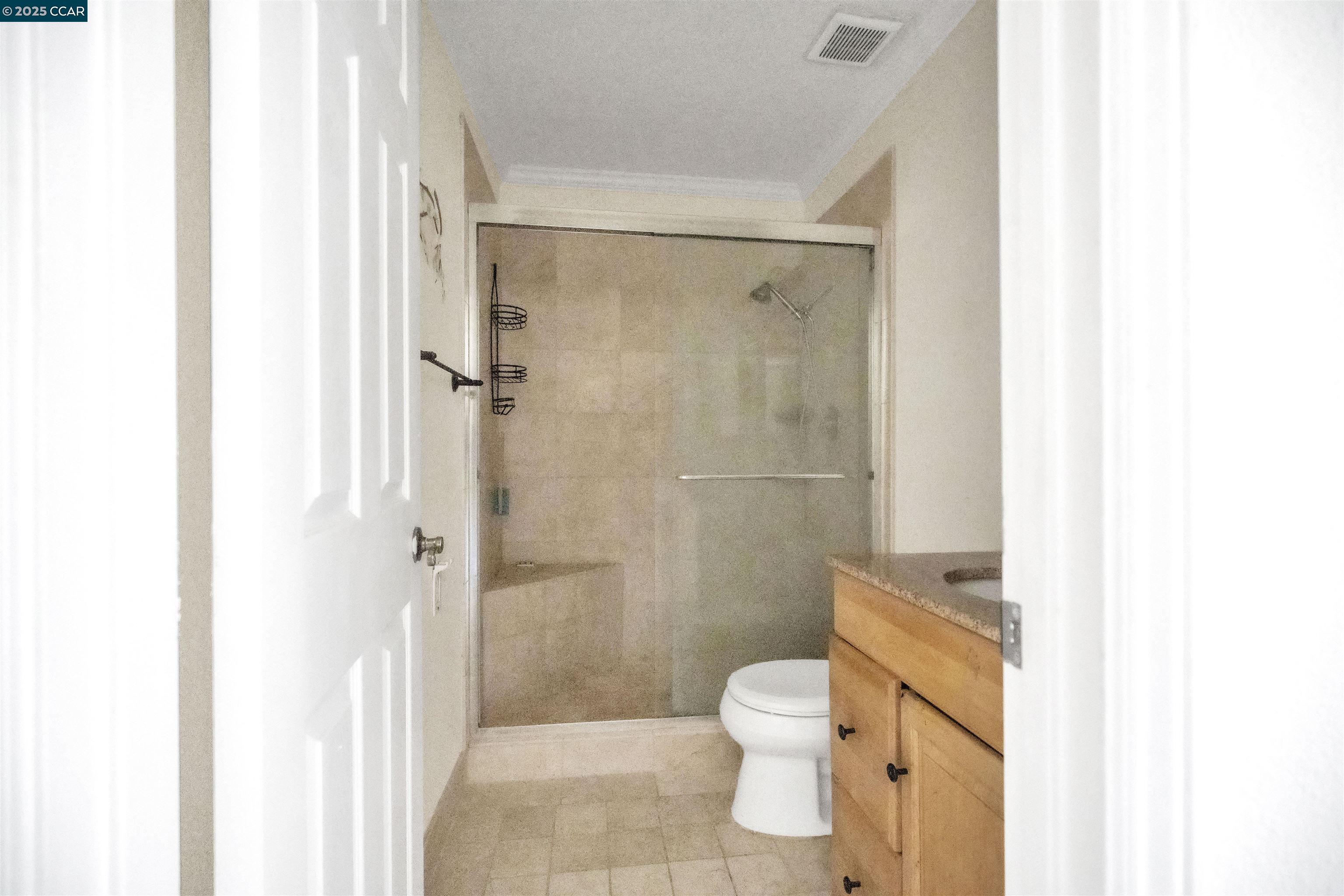 1544 Bailey Road, Unit 30 Concord, CA 94521 - Photo 9 of 20 a bathroom with a toilet and a shower