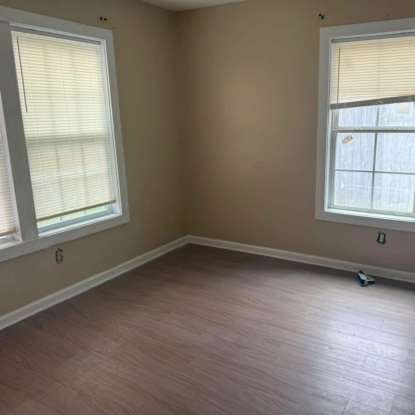3596 Kendrick Road Memphis, TN 38108 - Photo 4 of 9 Unfurnished room featuring dark wood finished floors and healthy amount of natural light