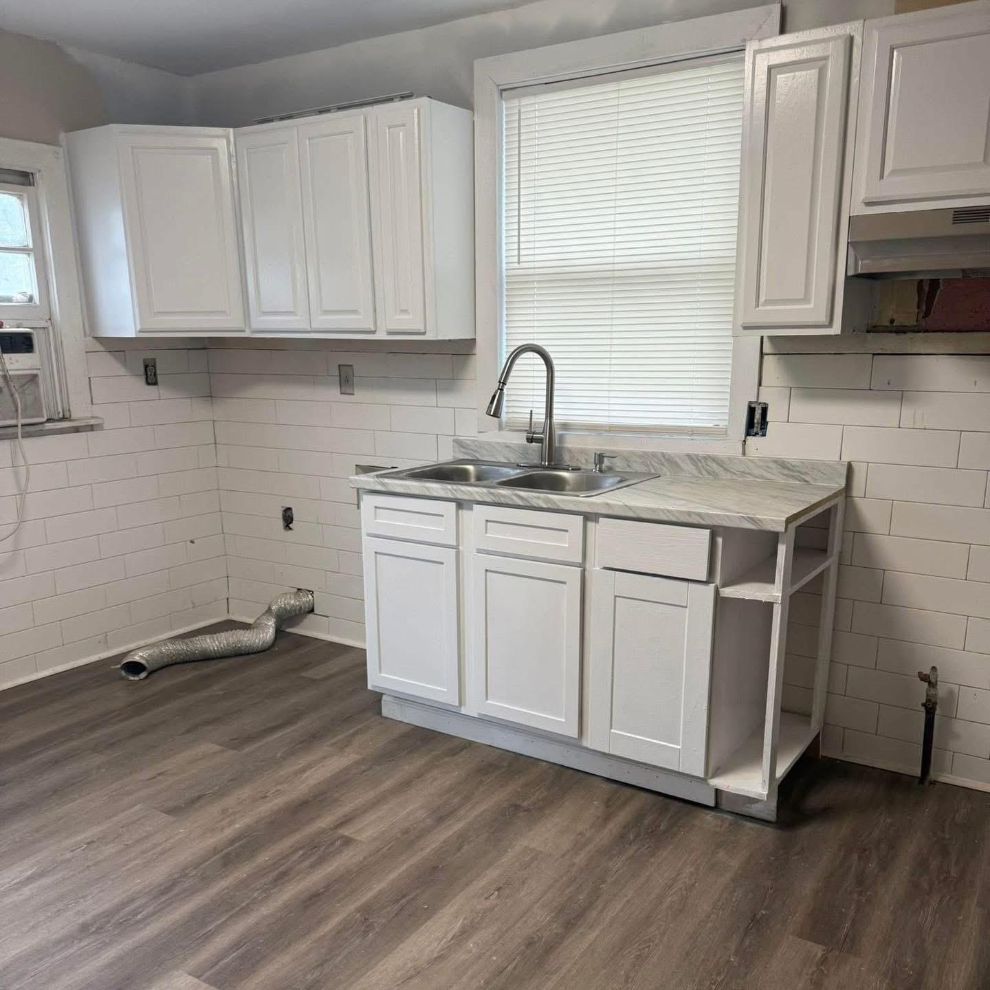 3596 Kendrick Road Memphis, TN 38108 - Photo 5 of 9 Washroom with dark wood finished floors