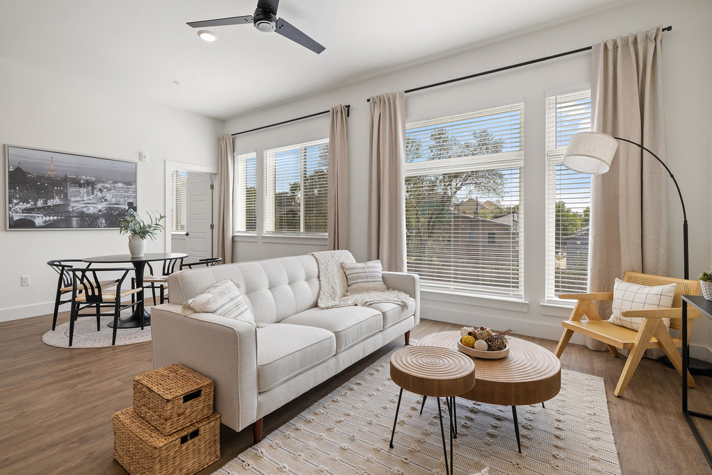 a living room with furniture and a large window