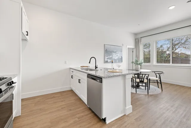 a kitchen with sink and cabinets