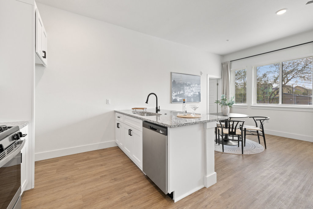 1811 Webberville Road, Unit 1209 Austin, TX 78721 - Photo 18 of 35 a kitchen with sink and cabinets