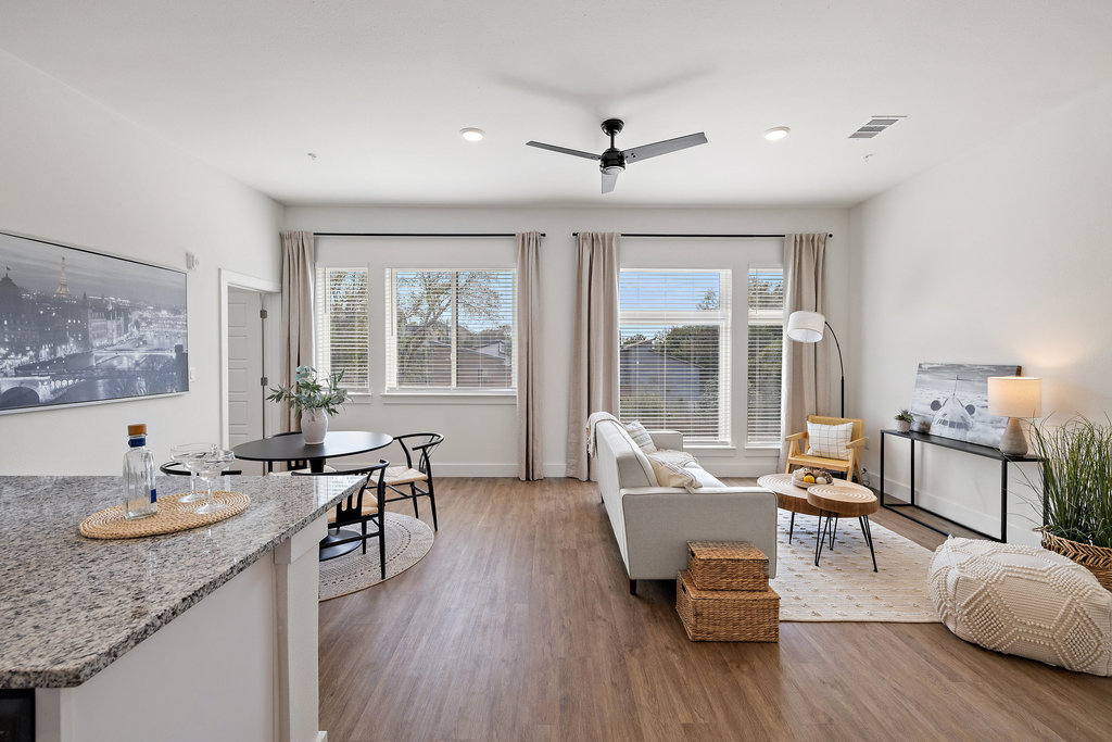 1811 Webberville Road, Unit 1209 Austin, TX 78721 - Photo 2 of 35 a living room with furniture and wooden floor
