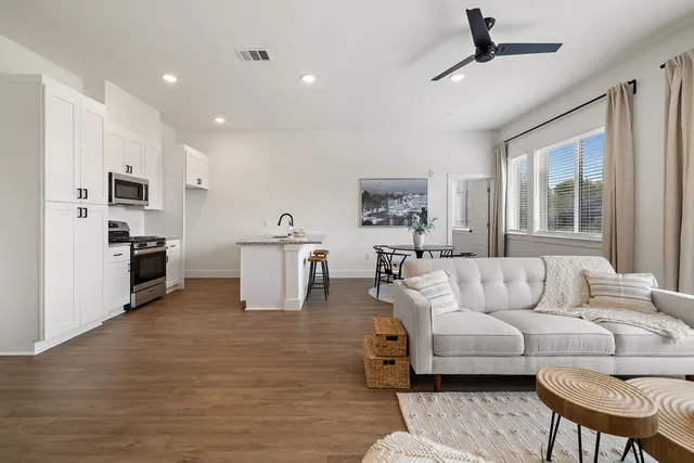 a living room with furniture and a large window