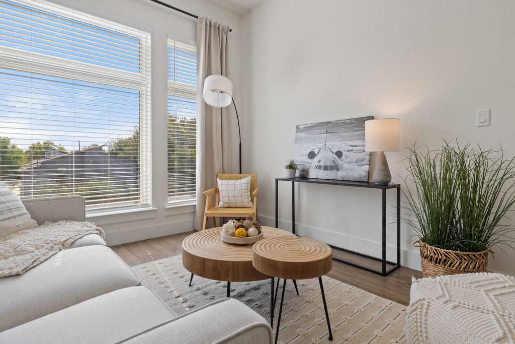 1811 Webberville Road, Unit 1209 Austin, TX 78721 - Photo 21 of 35 a living room with furniture and wooden floor