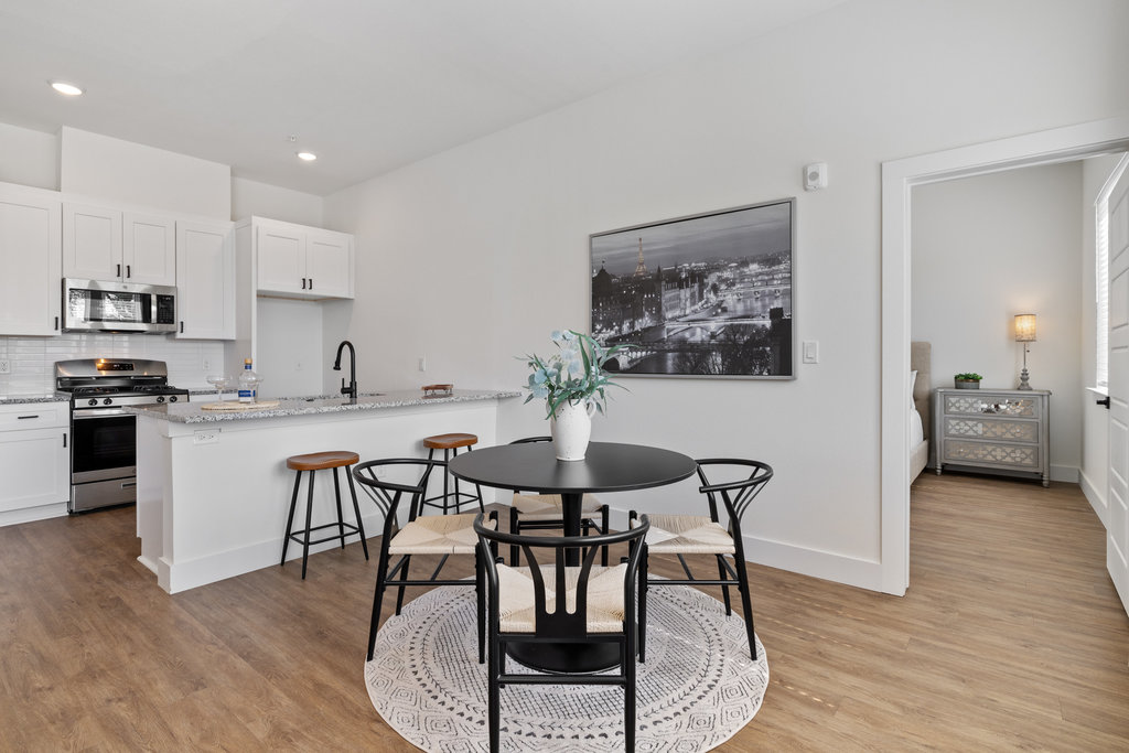 1811 Webberville Road, Unit 1209 Austin, TX 78721 - Photo 28 of 35 a view of a dining room with furniture and wooden floor