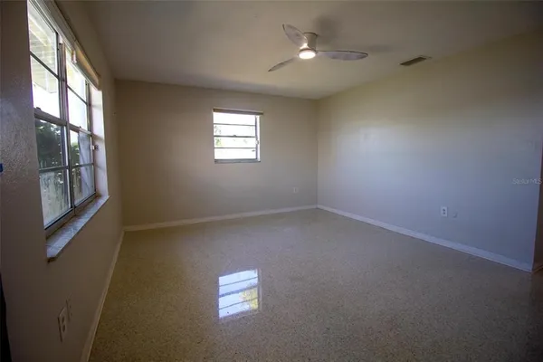 an empty room with windows