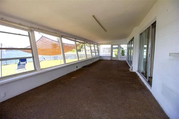 a view of an empty room with a large window