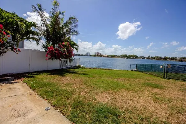 a view of a swimming pool with an outdoor space and seating area