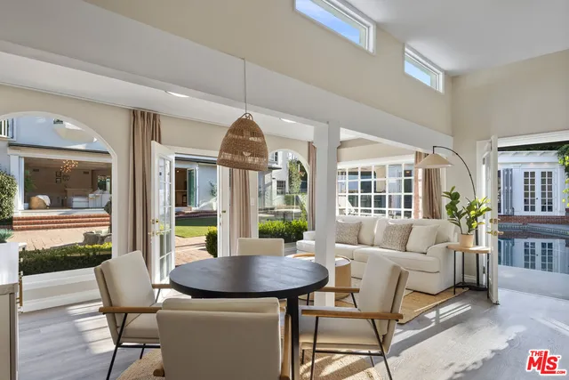 a front view of a house with garden and patio