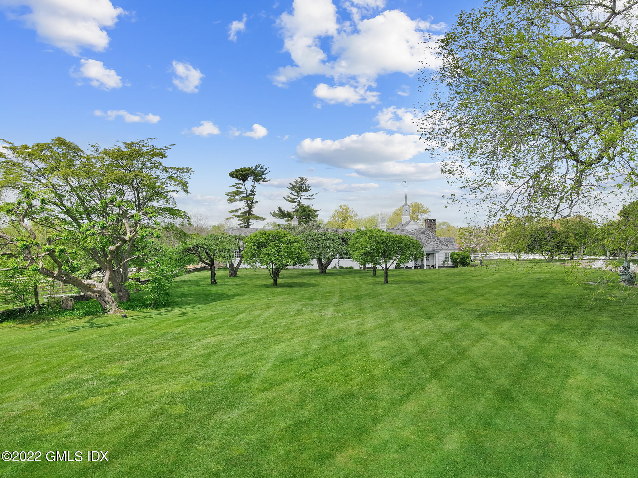 7 John Street Greenwich, CT 06831 - Photo 20 of 28 a view of a green field with lots of green space