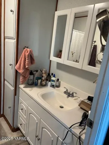 a bed sitting in a room next to a window