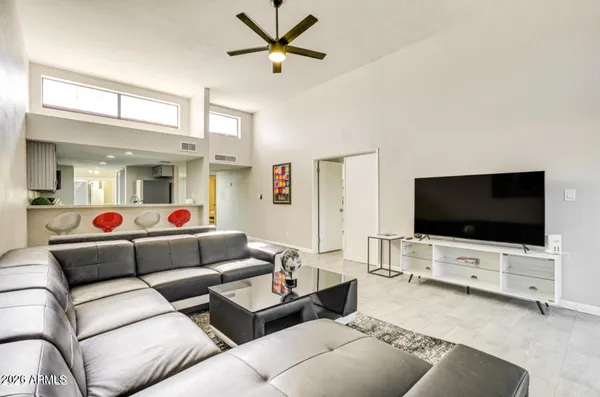 a living room with furniture and a flat screen tv