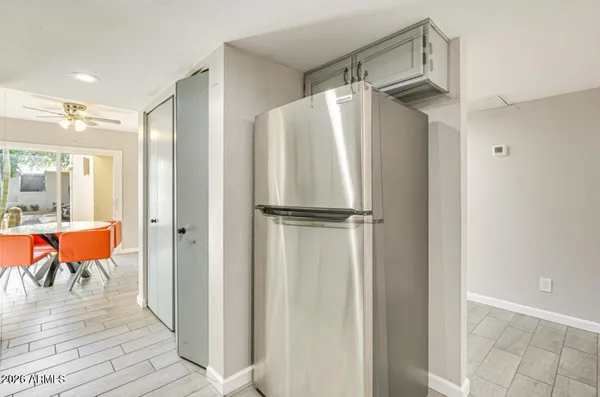 a bathroom with a glass shower door and a sink