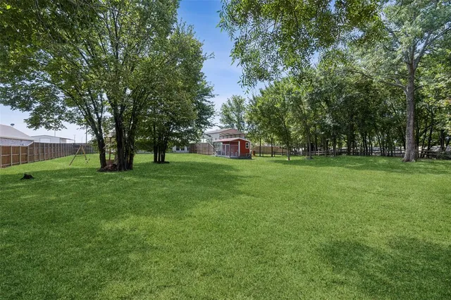 a view of a house with a big yard